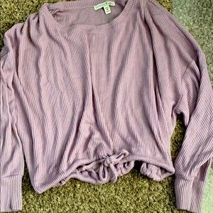 A lavender off the shoulder slightly cropped top